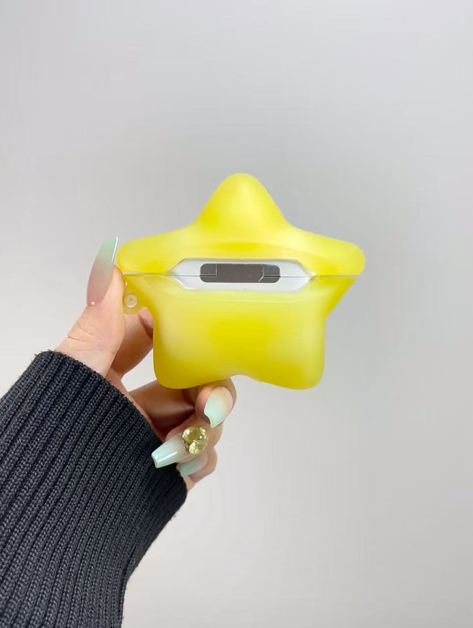 Grow-in-dark star AirPods case backward